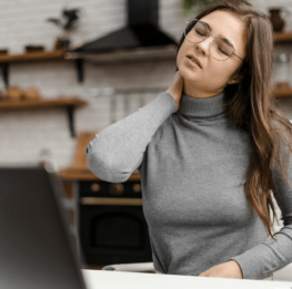 young-woman-having-neckache-while-working-from-home_23-2148813145